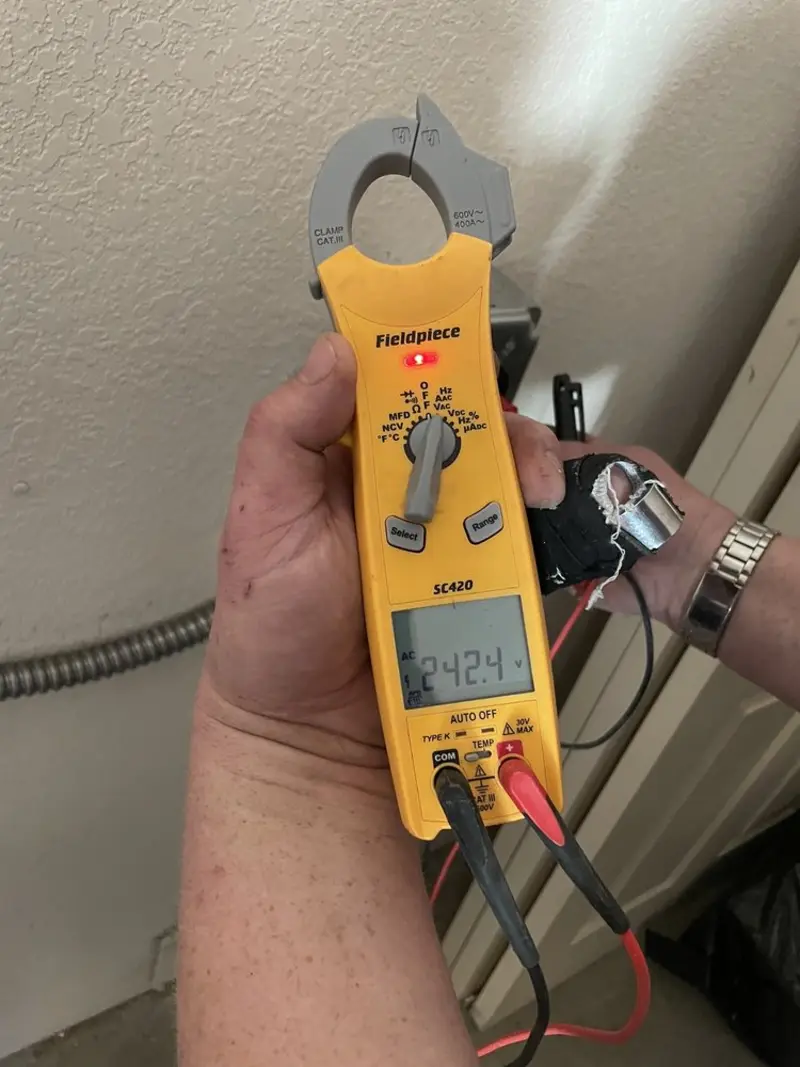 Voltage testing with clamp meter during Circuit Breaker Repair in Ithaca
